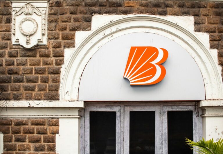 Bank of baroda logo on a building's facade.